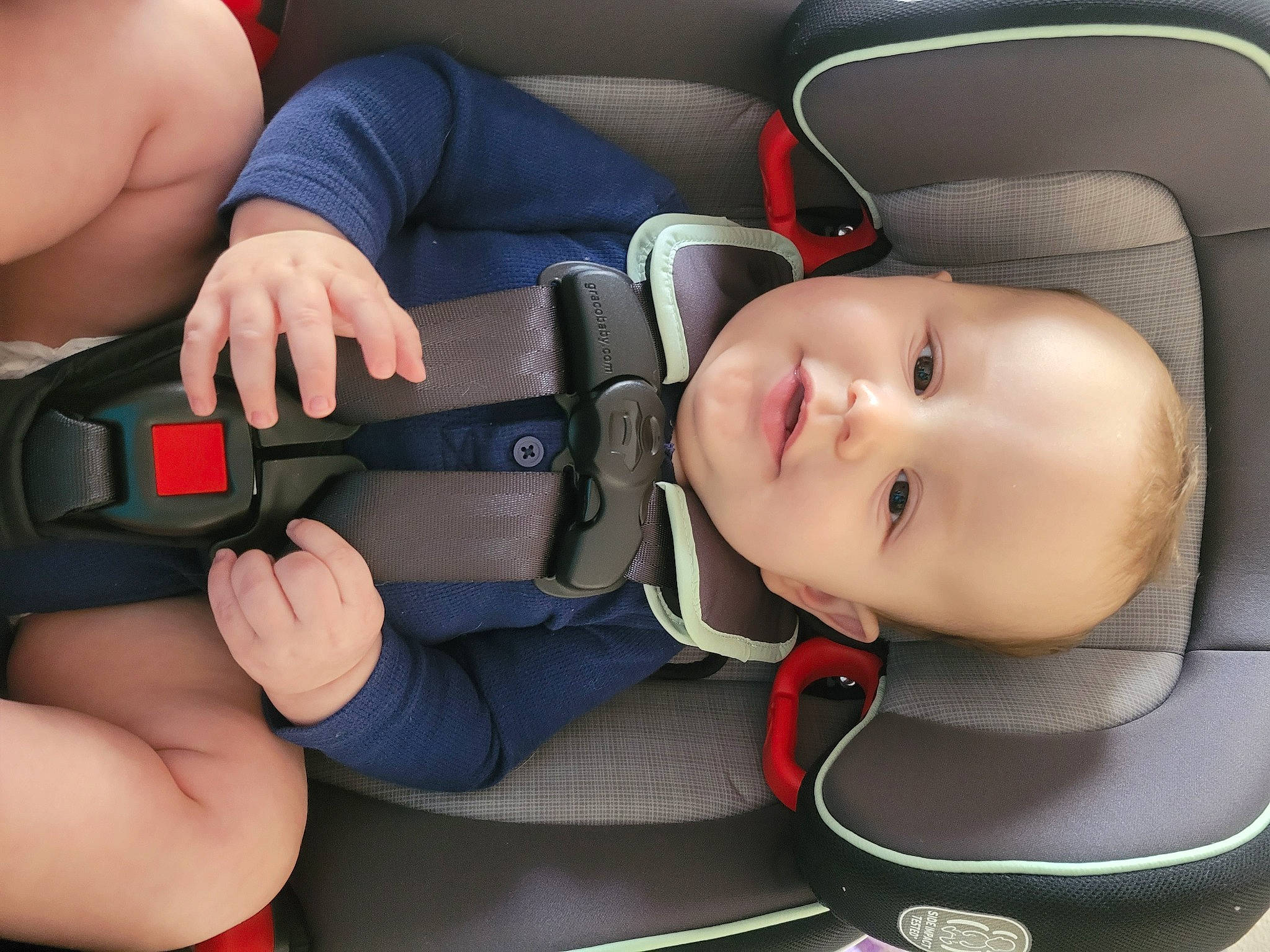 Emilio joined the competition — help win amazing prizes! arm, baby, baby_carriage, baby_in_car_seat, car_seat, cheek, comfort, finger, gesture, hand, human_body, leg, mouth, muscle, neck, person, product, seat_belt, skin, smile
