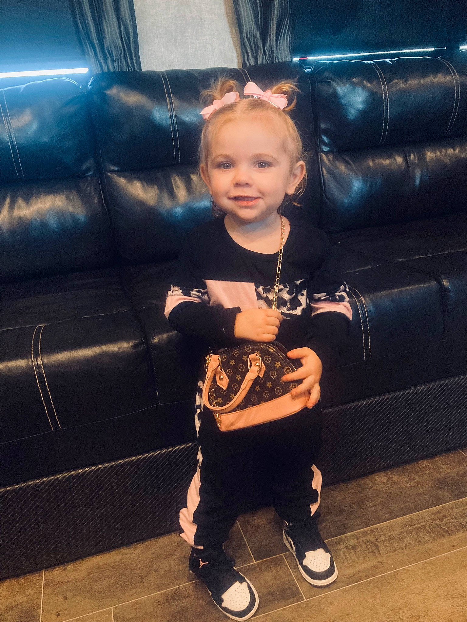 Rhyder is registered to the contest to win money with this photo: child, comfort, couch, darkness, electric_blue, eyewear, flash_photography, flooring, formal_wear, fun, happy, joy, leisure, luxury_vehicle, person, sitting, tints_and_shades, toddler