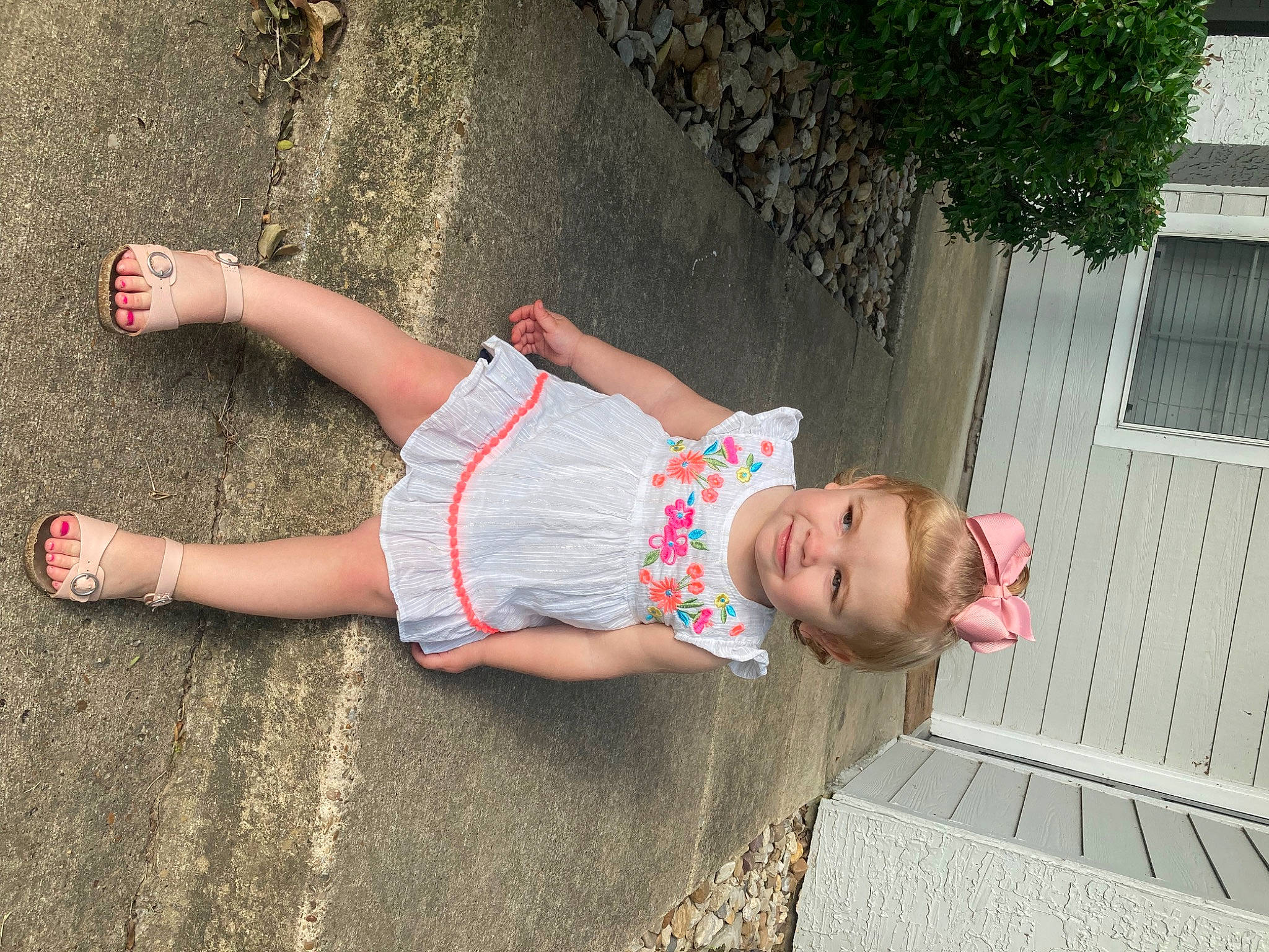 Rhyder joined the competition — help win amazing prizes! baby_toddler_clothing, child, concrete, foot, fun, grass, human_leg, joy, knee, leisure, person, plant, recreation, sandal, shorts, sitting, t_shirt, thigh, toddler, tree