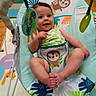 Giada is registered to the contest to win money with this photo: baby, baby_rocker, child, childcare, colorful, cute, fabric, footwear_absent, happy, indoors, infant, monkey_design, person, play_mat, playful, portrait, seat, smiling, toy, young
