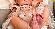 Giada is registered to the contest to win money with this photo: adorable, baby, barefoot, child, couch, curious, cute, fabric, furniture, hat, home, indoors, infant, peach_outfit, plush, portrait, relaxed, seated, small_feet, soft