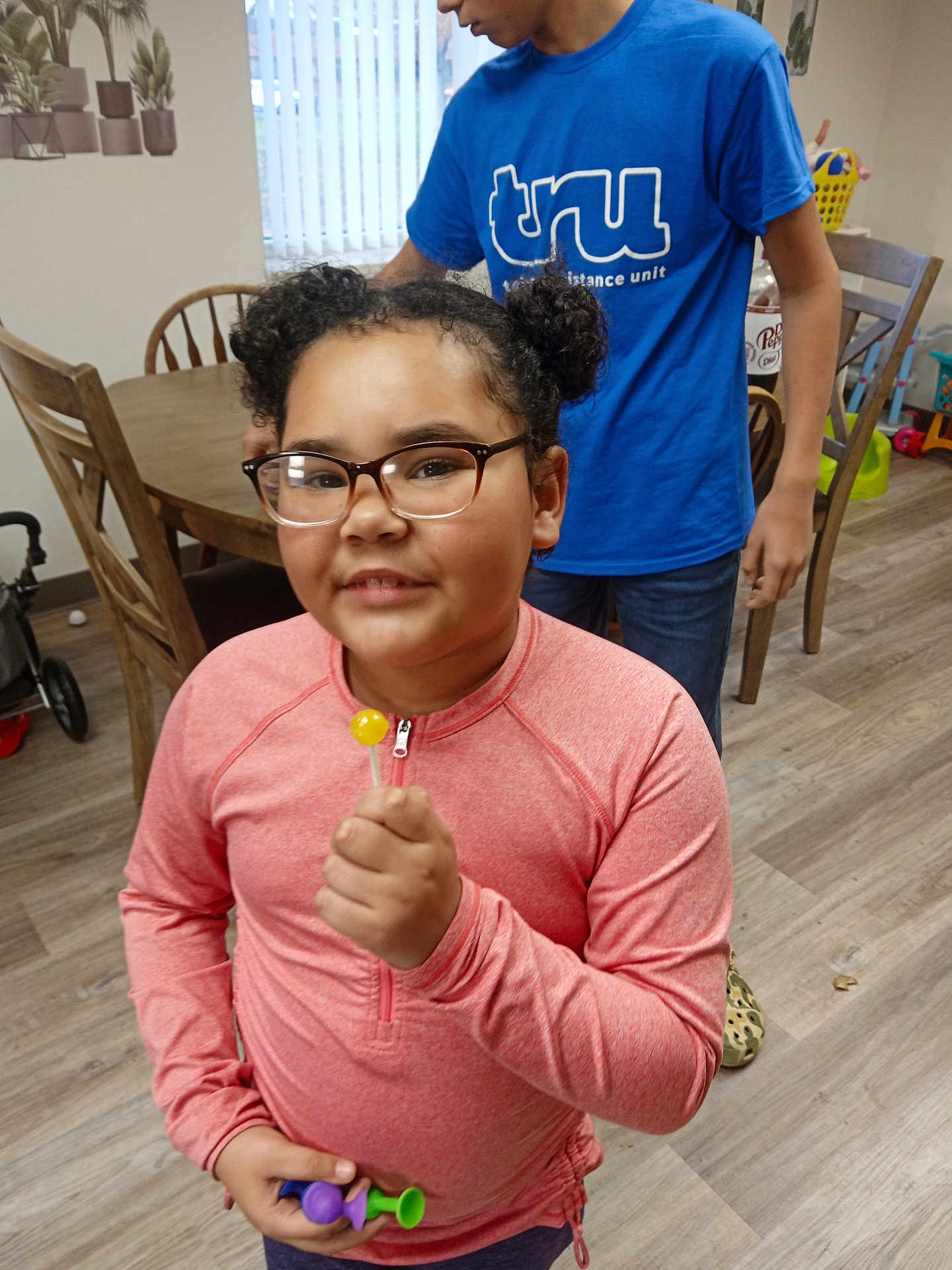 Mia Overton is registered to the contest to win money with this photo: accessories, adult, bodypart, clothing, face, female, finger, food, glasses, hand, hardwood, head, person, photography, plywood, portrait, sweets, t_shirt, woman, wood