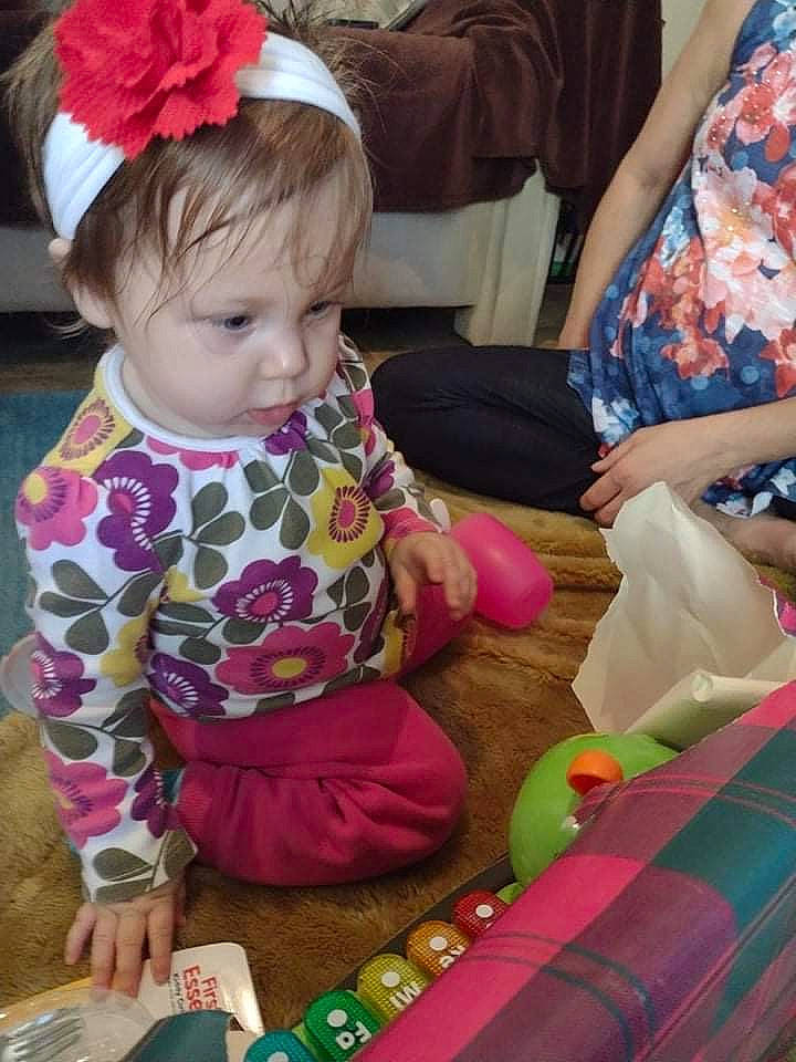 Estella is registered to the contest to win money with this photo: baby, baby_toddler_clothing, beauty, child, comfort, event, flooring, fun, hairstyle, head, lap, pattern, people, person, pink, play, sharing, sitting, snapshot, textile