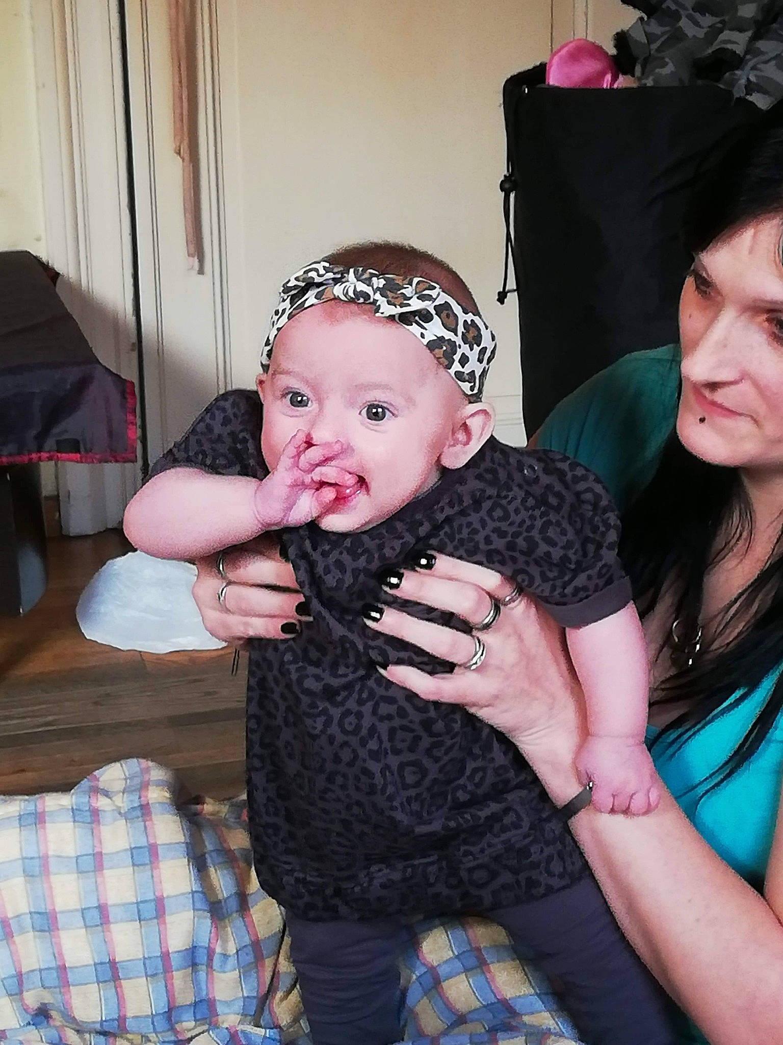 Kailly participe au concours pour gagner de l'argent avec cette photo : baby, black_hair, cheek, child, crochet, daughter, fashion_accessory, finger, fun, hair_accessory, hat, headband, headgear, joy, knitting, person, skin, toddler