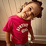 Marleigh is registered to the contest to win money with this photo: toddler, child, birthday, pink_shirt, bow, smile, chocolate_stain, barefoot, curly_hair, indoor, wall, carpet, casual_clothing, cute, portrait, happy, head_tilt, young_girl, playful, person