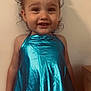 Marleigh joined the competition — help win amazing prizes! toddler, child, smiling, blue_top, bow, curly_hair, denim_shorts, standing, indoor, happy, person, face, clothing, portrait, cute, young_child, wall, buttoned_shorts, skin, hair_accessory
