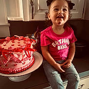 Marleigh joined the competition — help win amazing prizes! child, toddler, birthday_girl, pink_tshirt, jeans, cake, birthday_cake, kitchen, countertop, smile, face, ribbons, decorated_cake, curly_hair, bow, sitting, happy, indoor, celebration, food