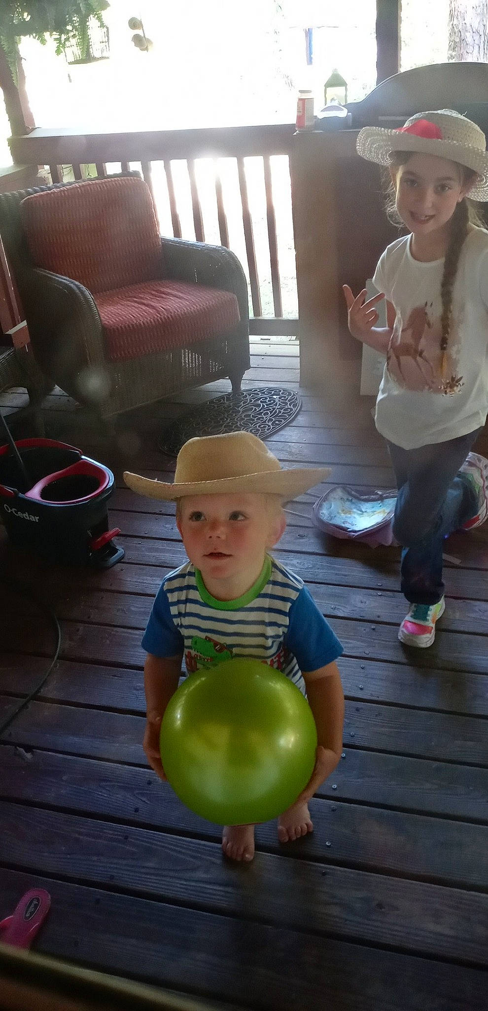 Trayse joined the competition — help win amazing prizes! balloon, cap, chair, child, facial_expression, floor, flooring, fun, green, happy, hat, head, headwear, joy, leisure, natural_foods, party_supply, person, sitting, standing