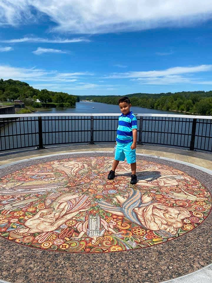 Dereck is registered to the contest to win money with this photo: art, autumn, child, concrete, floor, flooring, footwear, leaf, park, person, photography, plant, play, shoe, sky, toddler, tourism, tree, vacation