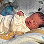 Jaxx joined the competition — help win amazing prizes! baby, blanket, clothing, cozy, cute, face, hand, head, indoors, infant, newborn, peaceful, person, portrait, resting, skin, sleep, sleeping, soft, young