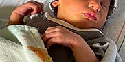 Jaxx is registered to the contest to win money with this photo: baby, blanket, child, closeup, clothing, cozy, cute, face, hand, hat, indoors, infant, nap, newborn, peaceful, portrait, resting, sleeping, soft, wrapped