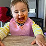 toddler, child, happy, smiling, messy_face, bib, yellow_striped_shirt, table, wooden_table, indoor, home, highchair, food_stains, reaching, face, person, cute, baby, clothing, portrait