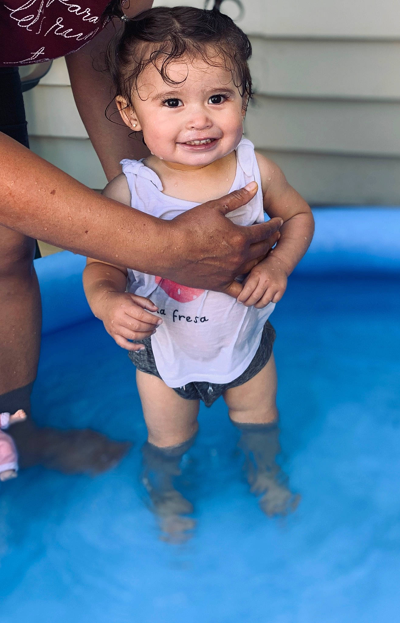 Lorena is registered to the contest to win money with this photo: arm, baby, blue, cheek, child, daughter, face, fun, happy, joy, leg, leisure, muscle, person, play, recreation, skin, smile, toddler, vacation