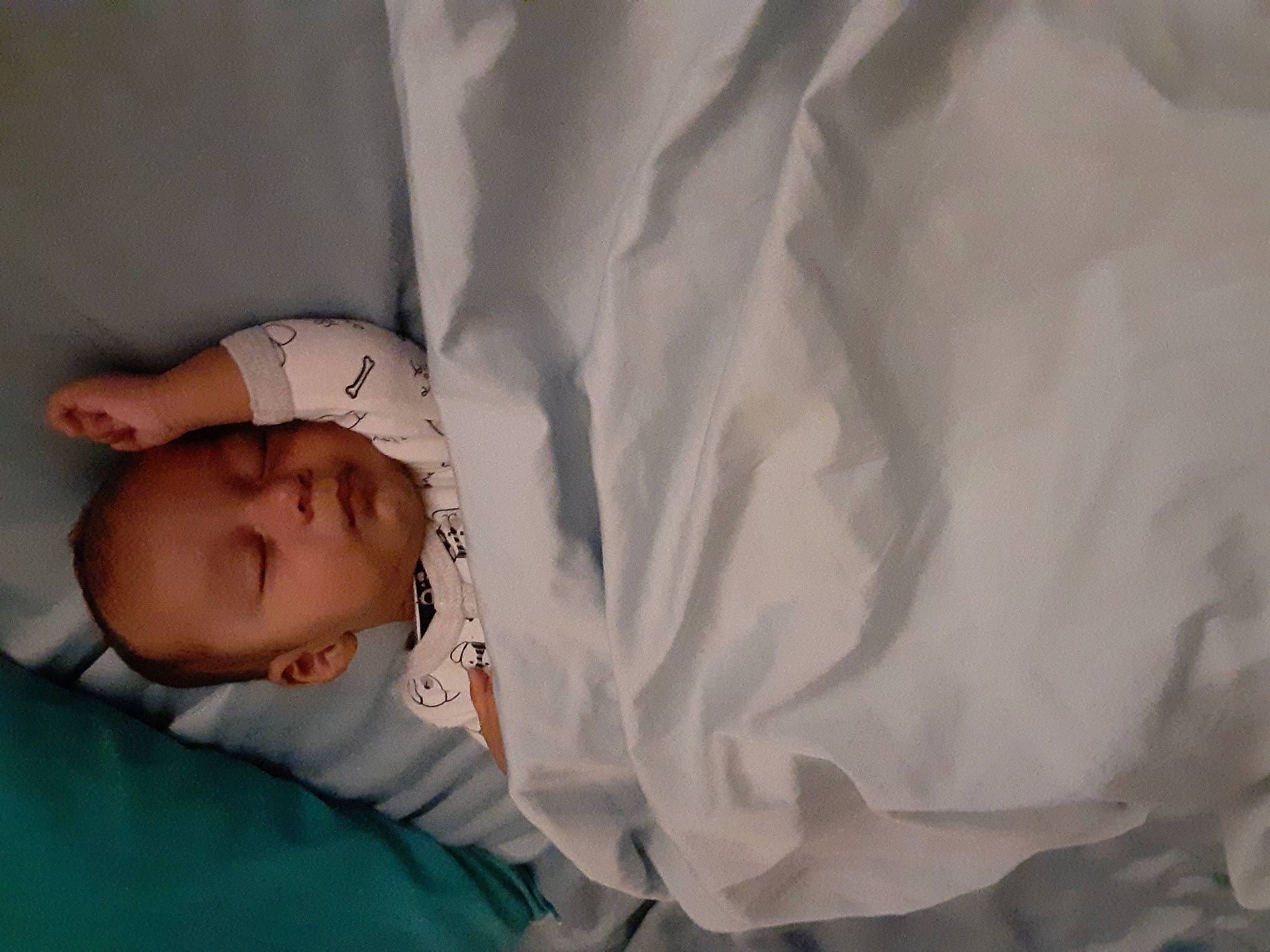 Jesus is registered to the contest to win money with this photo: baby, baby_products, baby_sleeping, baby_toddler_clothing, bedtime, bonnet, comfort, linens, person, sleep