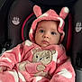Ashly is registered to the contest to win money with this photo: baby, child, onesie, pink, white, hood, ears, bear_design, car_seat, seat_belt, infant, cute, clothing, portrait, indoor, face, person, young_child, soft_texture, warm