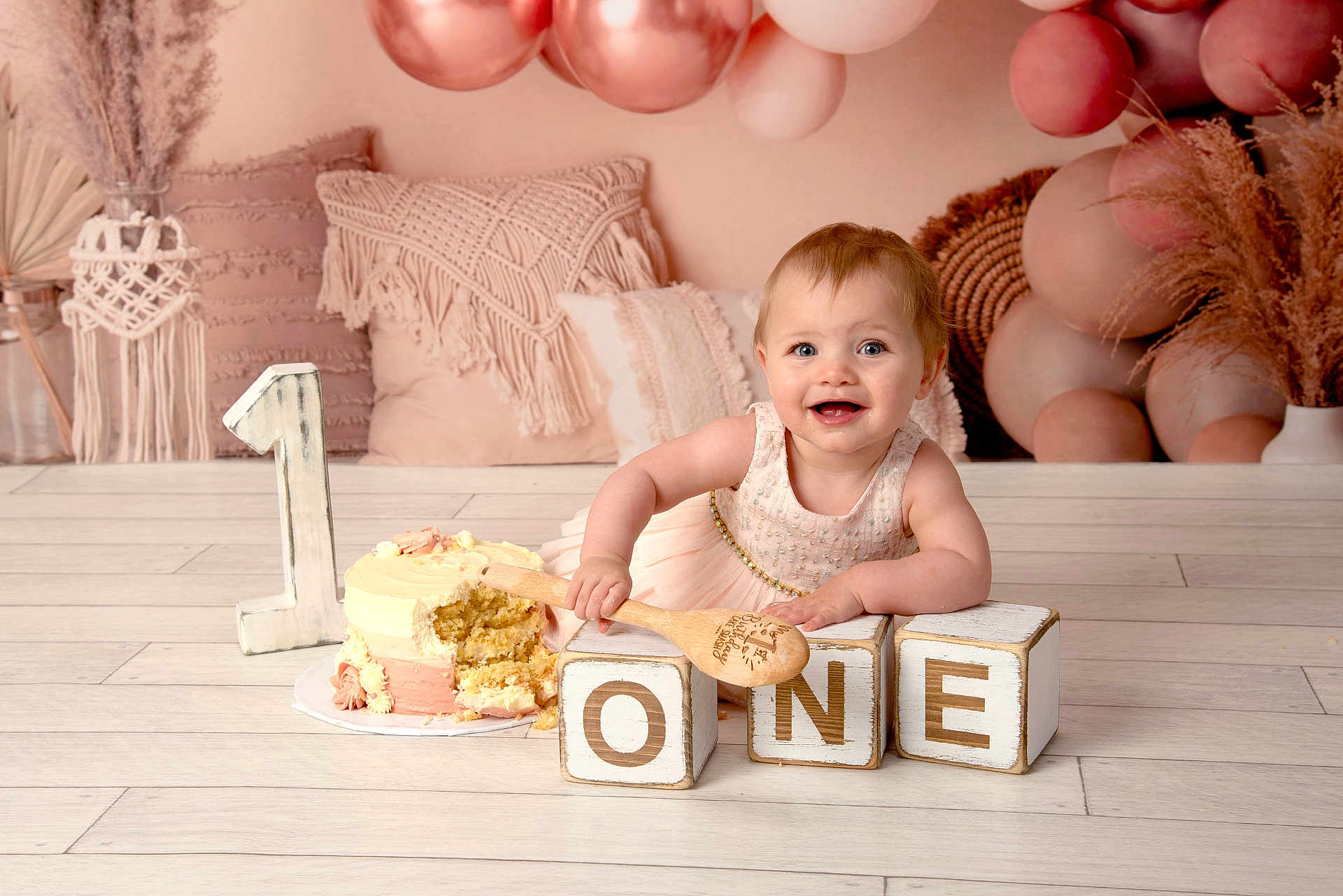 Freya joined the competition — help win amazing prizes! baby, child, birthday, cake, smiling, dress, wooden_blocks, number_one, spoon, balloons, pink, decor, floor, pillow, celebration, happy, face, indoors, cute, milestone