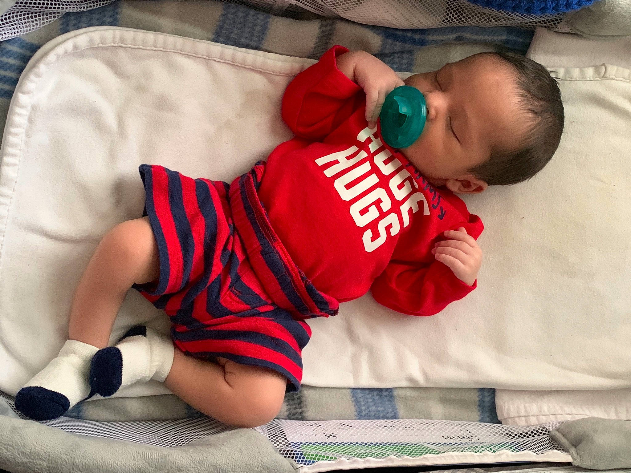 Dallas is registered to the contest to win money with this photo: arm, baby, baby_sleeping, baby_toddler_clothing, child, comfort, elbow, finger, happy, head, human_leg, joint, knee, leg, person, skin, sleeve, t_shirt, textile, thigh