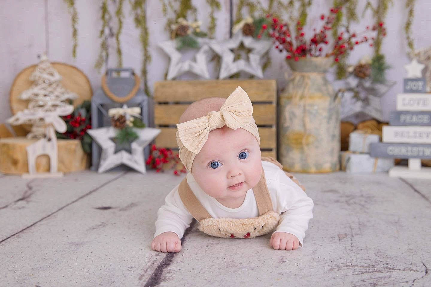Elodie joined the competition — help win amazing prizes! baby, baby_toddler_clothing, doll, dress, event, fashion_accessory, flooring, font, fur, happy, hat, headwear, ornament, peach, person, pink, room, sitting, toddler, toy