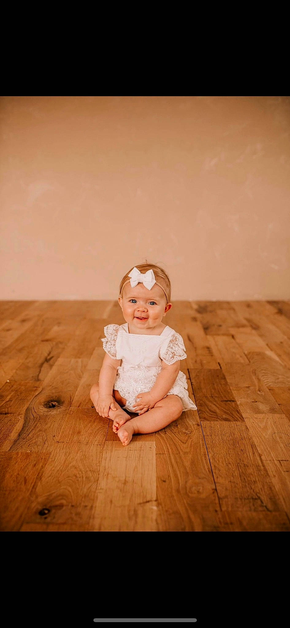 Caroline is registered to the contest to win money with this photo: baby, baby_toddler_clothing, child, flash_photography, floor, flooring, fun, grass, happy, hardwood, headwear, joy, laminate_flooring, people_in_nature, person, sitting, skin, smile, tints_and_shades, toddler