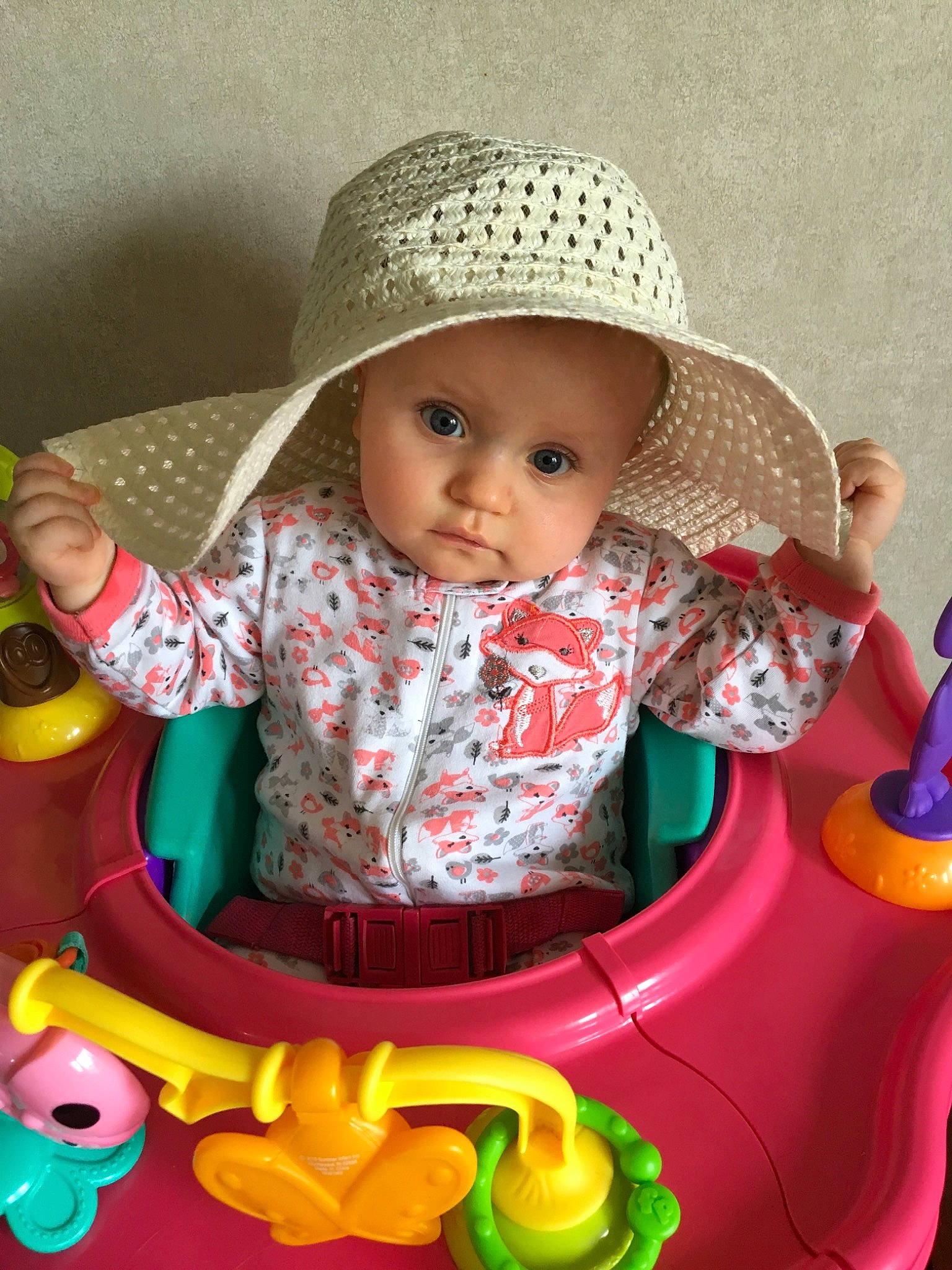 Mia is registered to the contest to win money with this photo: baby, baby_products, baby_toys, child, hat, headgear, headwear, person, play, product, sitting, skin, sun_hat, toddler, toy