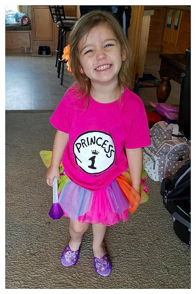 Addilyn is registered to the contest to win money with this photo: baby_toddler_clothing, child, clothing, costume, joy, person, pink, purple, smile, t_shirt, toddler, violet