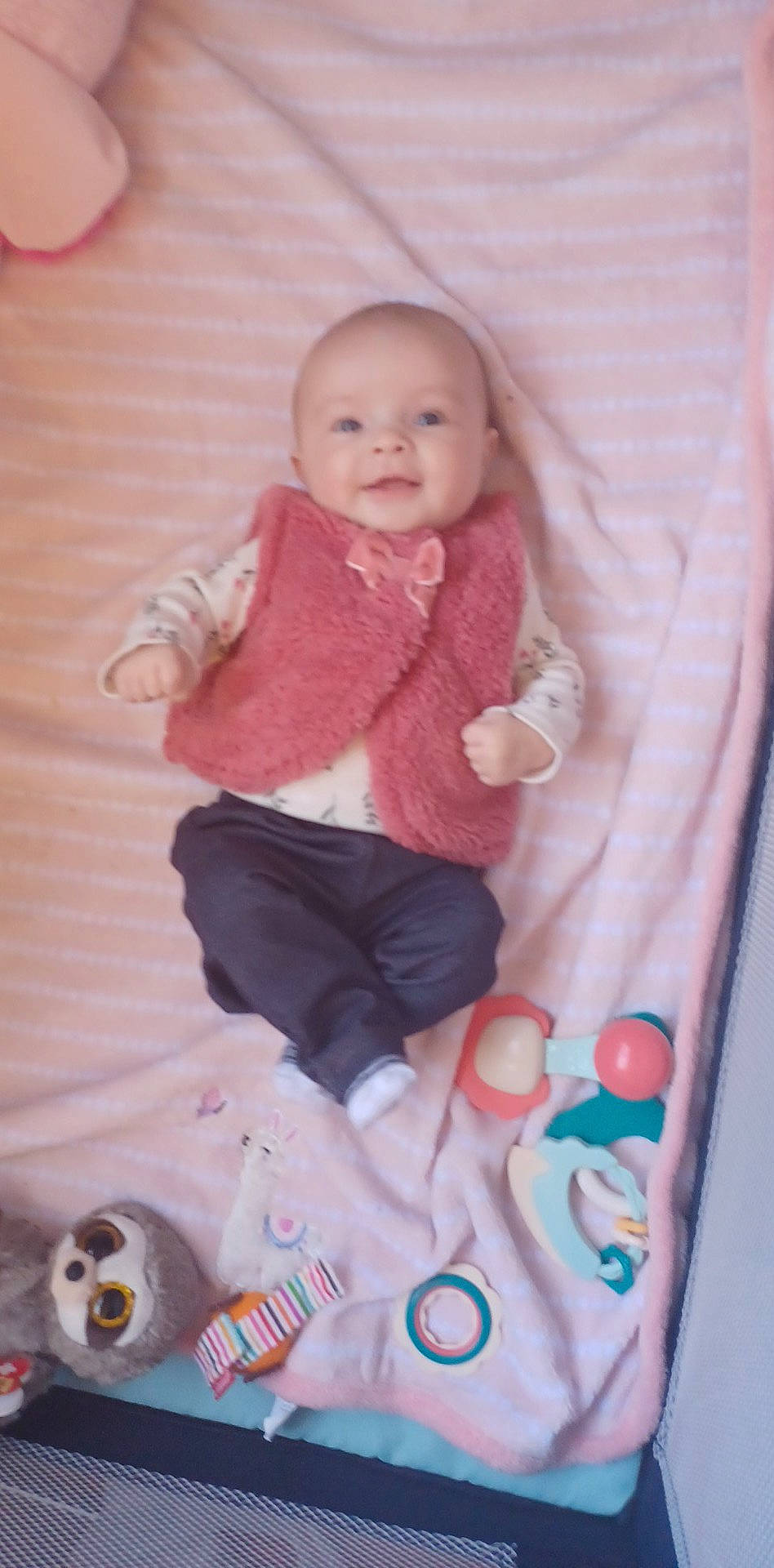 Myah is registered to the contest to win money with this photo: arm, baby, baby_toddler_clothing, cheek, child, doll, hand, head, magenta, pattern, person, pink, product, sitting, skin, sleeve, smile, textile, toddler, toy