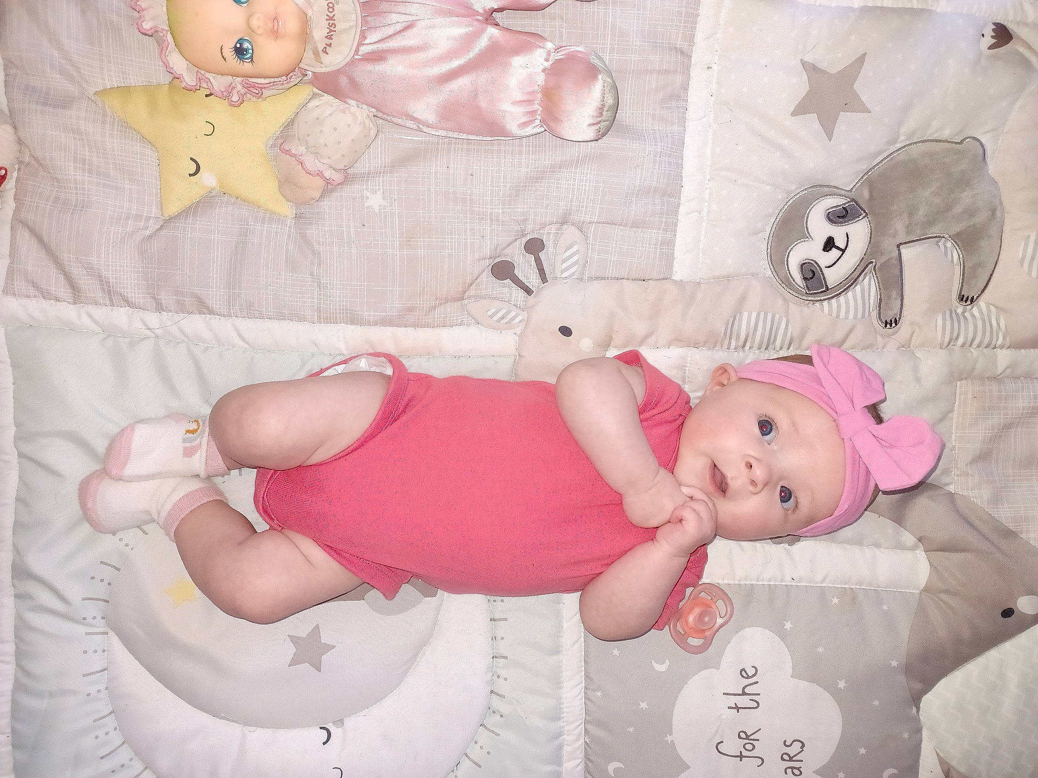 Myah is registered to the contest to win money with this photo: arm, baby, baby_products, baby_toddler_clothing, cheek, child, comfort, headwear, lap, linens, pattern, person, pink, product, room, skin, smile, textile, thigh, toddler