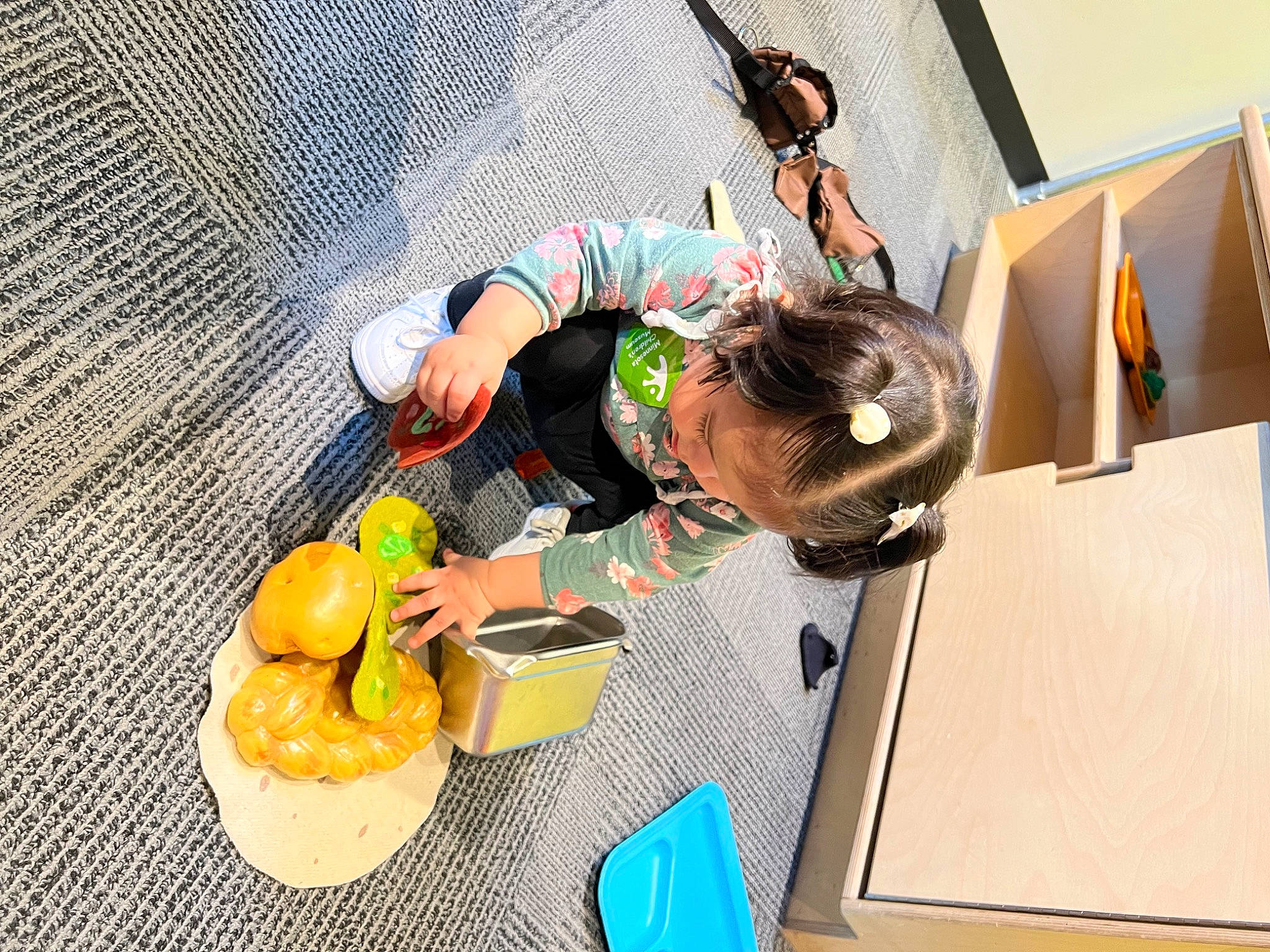 Ariana Layla is registered to the contest to win money with this photo: animation, bag, child, citrus, eyewear, finger_food, food, fruit, fun, grapefruit, leisure, natural_foods, orange, person, recreation, room, shipping_box, sitting, tableware, toddler
