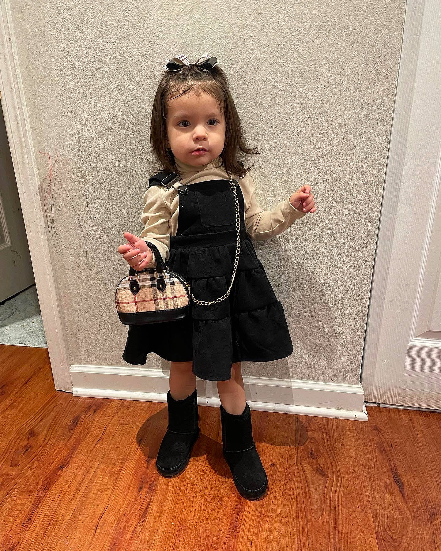 Analiyah Everly joined the competition — help win amazing prizes! arm, baby_toddler_clothing, black_hair, dress, fashion_design, floor, flooring, footwear, hair, head, human_body, joint, knee, neck, outerwear, person, skin, sleeve, standing, waist