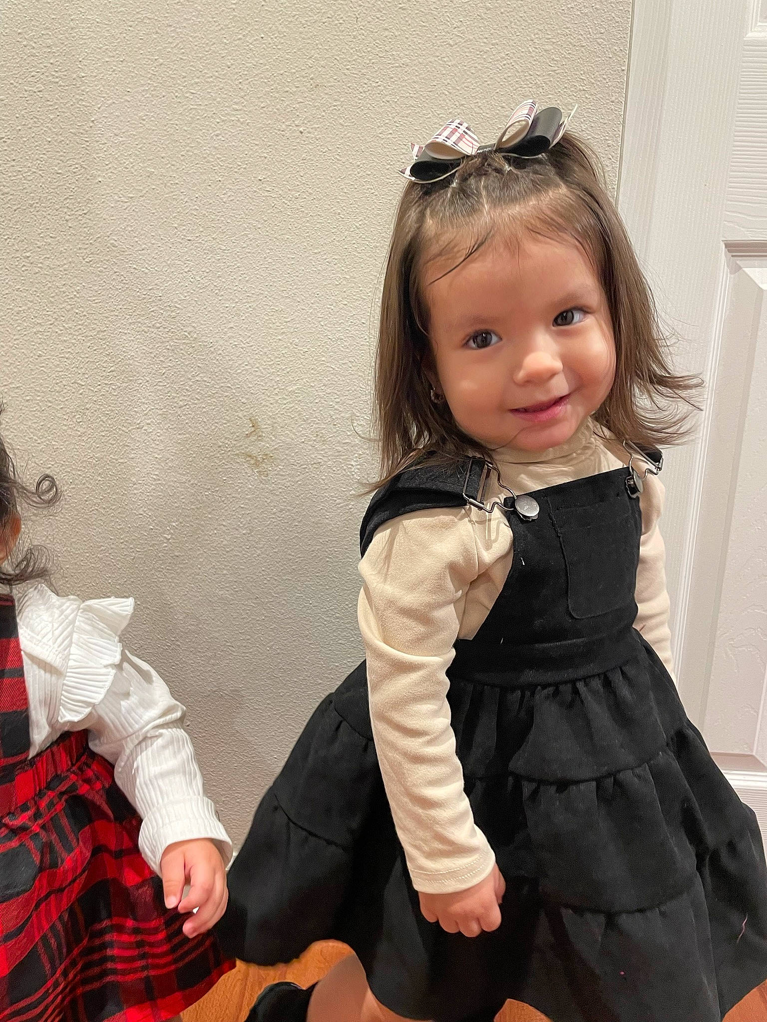 Analiyah Everly is registered to the contest to win money with this photo: baby_toddler_clothing, black, clothing, day_dress, doll, dress, eyelash, fashion_design, gesture, goggles, hair, iris, joy, neck, one_piece_garment, person, shoulder, skin, sleeve, standing