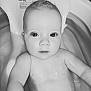 Aurora is registered to the contest to win money with this photo: arm, baby, bath, bath_seat, bathtub, black_and_white, child, close_up, cute, expression, eyes, face, head, indoors, infant, portrait, relaxing, skin, water, wet_skin