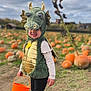 Aayla-Louise joined the competition — help win amazing prizes! child, toddler, costume, dragon, pumpkin_patch, orange_bucket, pink_boots, minnie_mouse, outdoor, fall, cloudy_sky, smiling, cute, festival, halloween, field, grass, dirt_path, holiday, playful