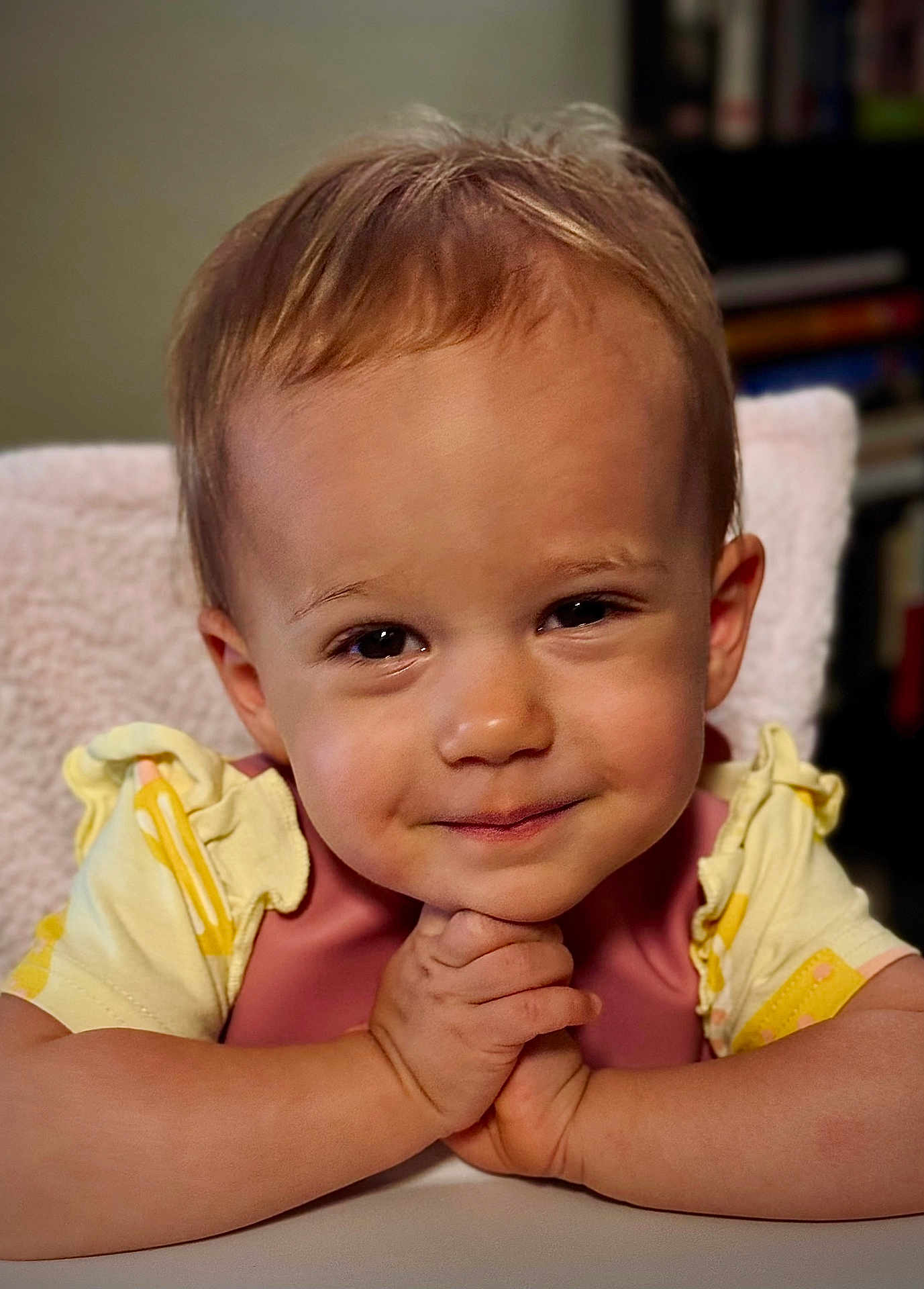 Sofia is registered to the contest to win money with this photo: toddler, child, smile, face, hands, hair, clothing, bib, skin, eyes, portrait, expression, indoor, person, cute, baby, infant, young_child, sitting, closeup