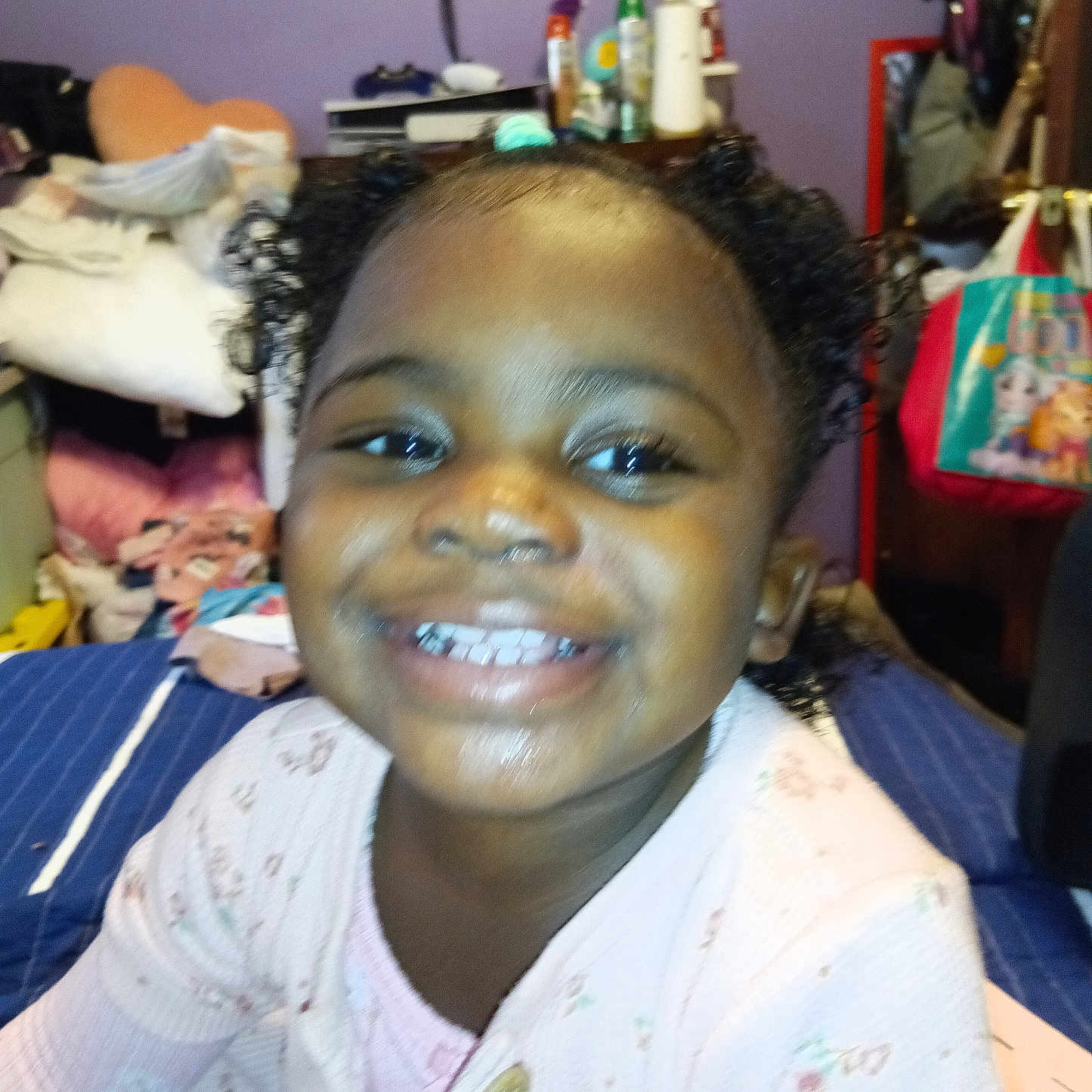 Maranda is registered to the contest to win money with this photo: accessories, bag, child, clothing, couch, earring, face, female, furniture, girl, handbag, happy, head, indoors, jewelry, person, photography, portrait, smile, t_shirt