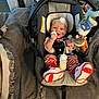 Amyra joined the competition — help win amazing prizes! baby, infant, car_seat, bottle, toy, headband, striped_pants, red_and_white, footwear, blanket, indoor, person, child, holding, smiling, seat_belt, soft_toys, clothing, cute, home