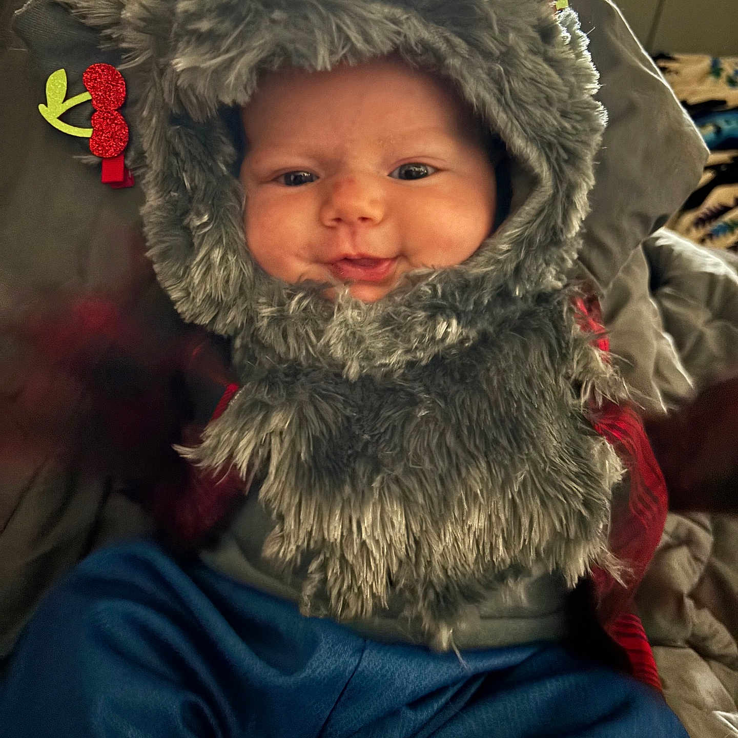 Amyra joined the competition — help win amazing prizes! adorable, baby, blanket, blue_pants, cheeks, child, closeup, clothing, cozy, cute, eyes, fur_hood, hood, indoor, infant, jacket, portrait, seated, smile, soft_fur
