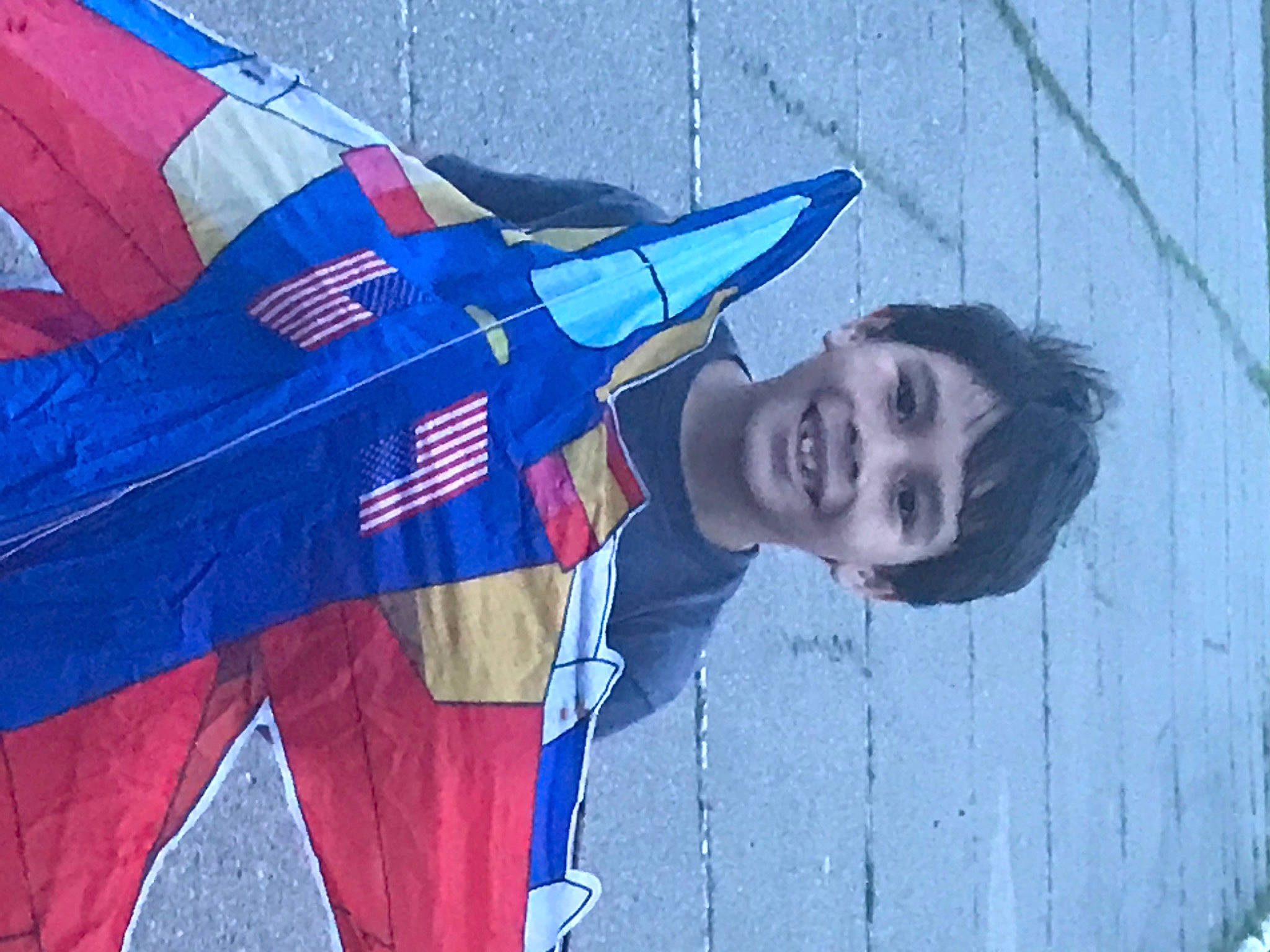 Julian is registered to the contest to win money with this photo: aerospace_engineering, aerospace_manufacturer, air_travel, aircraft, airplane, art, aviation, azure, blue, carmine, electric_blue, flag, flag_of_the_united_states, fun, happy, joy, pattern, person, sky, smile