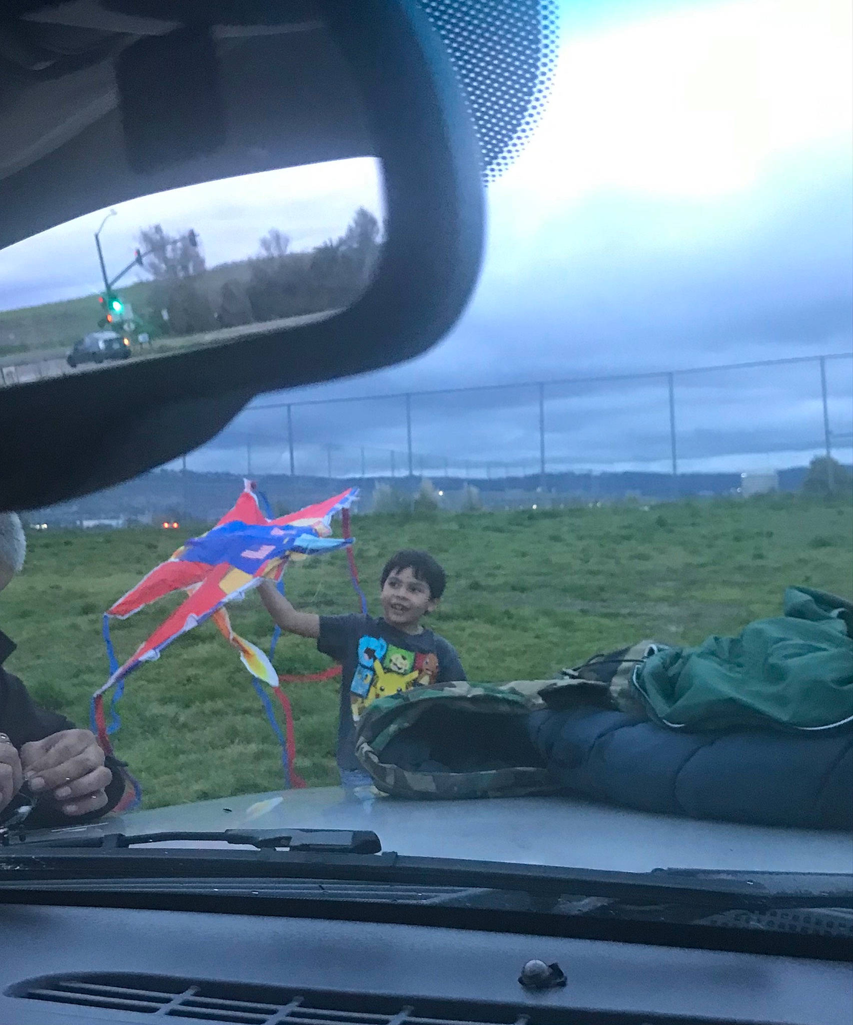 Julian is registered to the contest to win money with this photo: air_travel, aircraft, auto_part, automotive_exterior, automotive_mirror, automotive_tire, automotive_window_part, aviation, cloud, glass, hood, mode_of_transport, motor_vehicle, person, rear_view_mirror, sky, vehicle, vehicle_door, window, windscreen_wiper