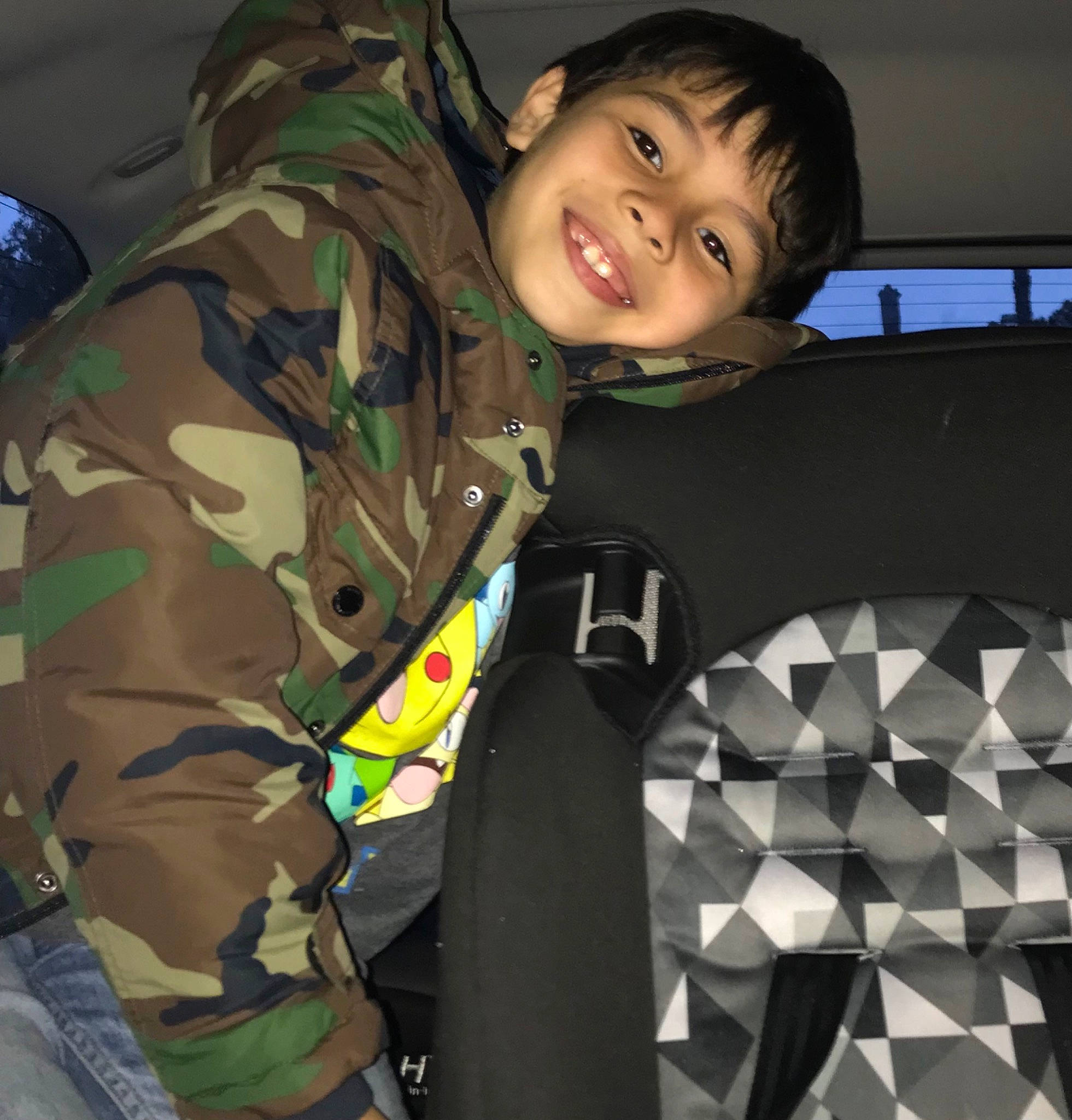 Julian is registered to the contest to win money with this photo: camouflage, child, comfort, flash_photography, fun, gesture, joy, military, military_camouflage, military_organization, military_person, military_uniform, pattern, person, personal_protective_equipment, sleeve, smile, soldier, t_shirt, toddler