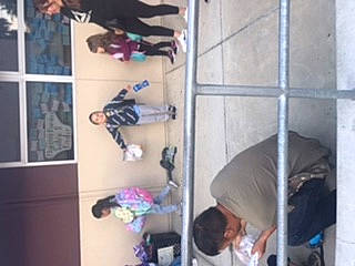 Jesse is registered to the contest to win money with this photo: blurred, ceiling, child, floor, flooring, fun, hardwood, hat, interior_design, magenta, person, play, purple, recreation, room, snapshot, t_shirt, thigh, violet, walking_shoe