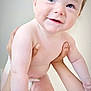 Loïs participe au concours pour gagner de l'argent avec cette photo : baby, child, infant, hands, skin, diaper, smile, happy, cute, portrait, person, young, human, closeup, face, arms, indoor, light, expression, holding