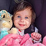 baby, child, blue_eyes, blanket, pink_blanket, plush_toy, bunny, smiling, happy, cute, car_seat, infant, soft_toy, cozy, portrait, child_in_car_seat, clothing, hand, face, young_child