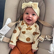 Charlyse participe au concours pour gagner de l'argent avec cette photo : baby, smiling, infant, headband, polka_dot, knitted_pants, baby_seat, straps, cute, happy, clothing, child, portrait, indoors, cushion, person, seat, apparel, headwear, baby_fashion