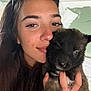 Apollo a rejoint le concours — aidez-le/la à gagner de superbes lots ! woman, puppy, dog, pet, face, close_up, portrait, long_hair, smile, hand, indoor, casual, young_adult, eyebrows, eyelashes, furry, cute, holding, sunglasses, background