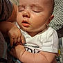 Elvis is registered to the contest to win money with this photo: arms, baby, closed_eyes, closeup, clothing, comfort, cute, face, hand, human, indoor, infant, newborn, onesie, peaceful, person, resting, skin, sleeping, soft