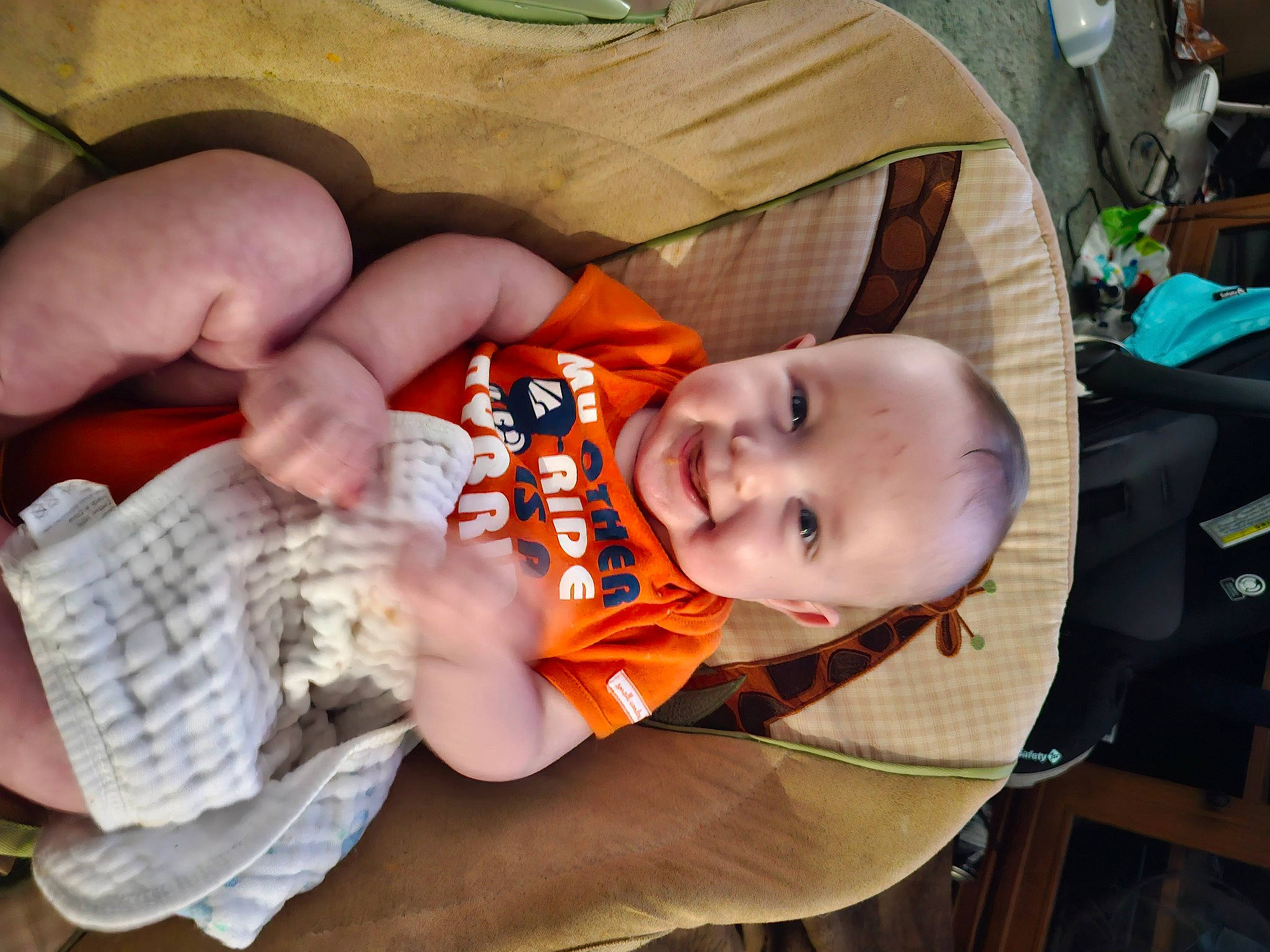 Gavin joined the competition — help win amazing prizes! baby, baby_carriage, baby_products, baby_toddler_clothing, child, comfort, finger, fun, hat, joy, mammal, mouth, nail, orange, person, product, sitting, toddler