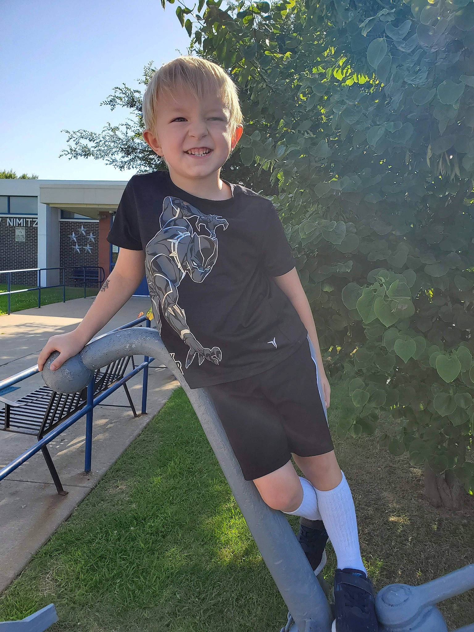 Stewart is registered to the contest to win money with this photo: cool, electric_blue, face, flash_photography, fun, grass, happy, human_leg, joy, knee, leisure, people_in_nature, person, shorts, sleeve, smile, sock, sportswear, standing, t_shirt