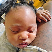 Amiri Evans is registered to the contest to win money with this photo: baby, sleeping, close_up, face, hair, hand, tattoo, skin, indoors, child, resting, peaceful, cozy, clothing, portrait, infant, cute, expression, relaxation, person