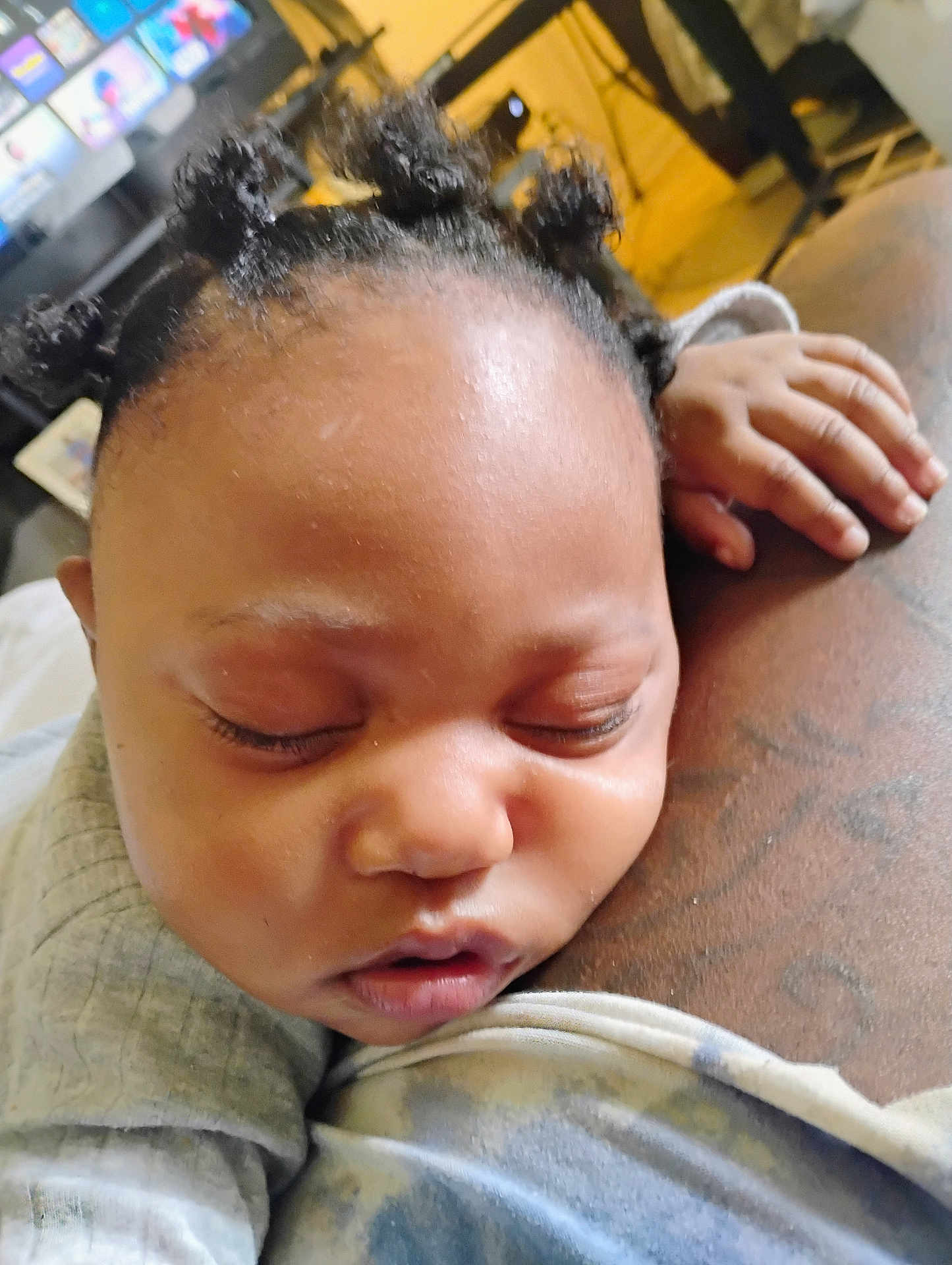 Amiri Evans is registered to the contest to win money with this photo: baby, sleeping, close_up, face, hair, hand, tattoo, skin, indoors, child, resting, peaceful, cozy, clothing, portrait, infant, cute, expression, relaxation, person