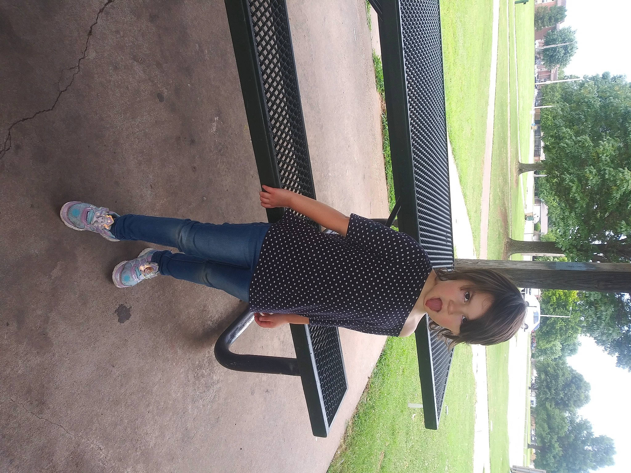 Sadie is registered to the contest to win money with this photo: elbow, electric_blue, fun, grass, human_leg, knee, leisure, pattern, person, recreation, shade, shadow, sky, thigh, tints_and_shades, tree, waist, walking_shoe, window